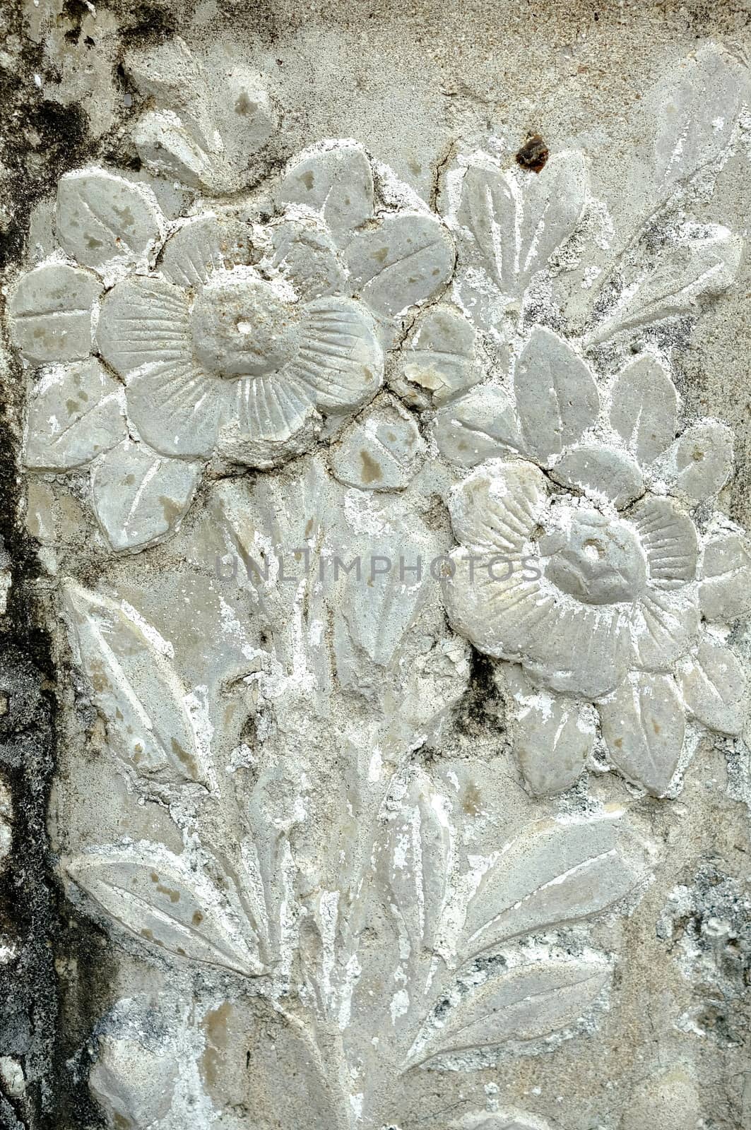 Vintage Thai Sculpture on Stone Wall. by mesamong