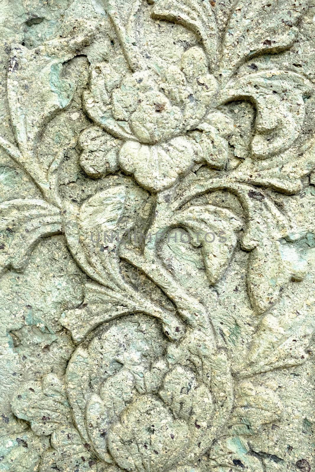 Vintage Thai Sculpture on Stone Wall.