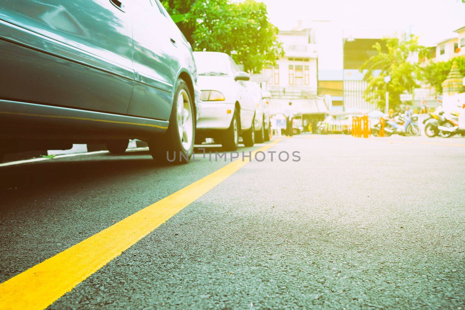 Bottom View of Parking Car on Road Background with Light Leak. by mesamong