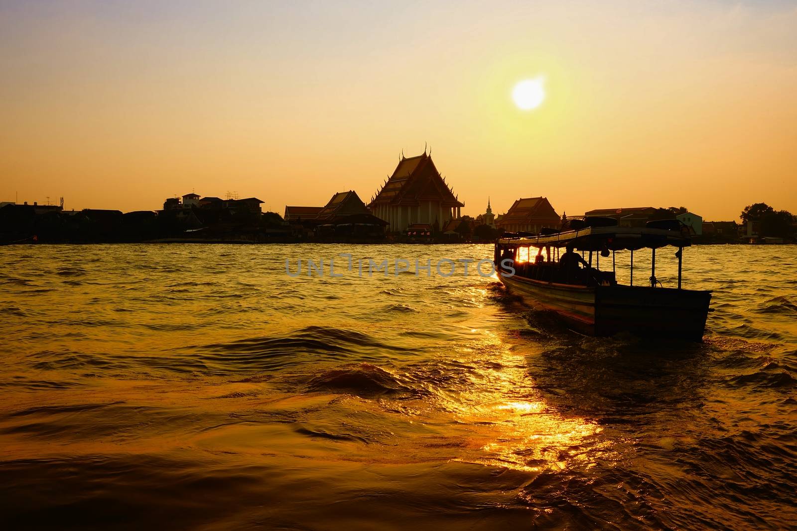 Scenery of Sunset at Chaophraya River at Pak Klong Talad Pier. Chaophraya River is the major river in Bangkok, Thailand. by mesamong