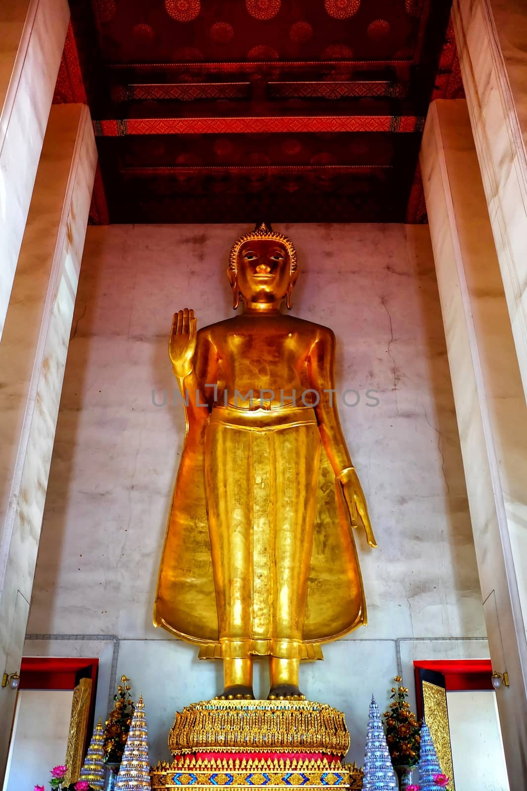 Ancient Huge Standing Buddha Image at Wat Saket Temple, Bangkok Thailand. by mesamong