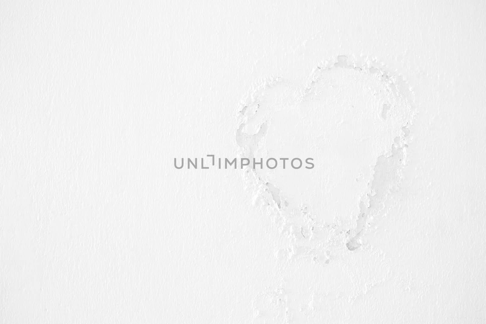 White Peeling Paint in Heart Shape on Concrete Wall. by mesamong