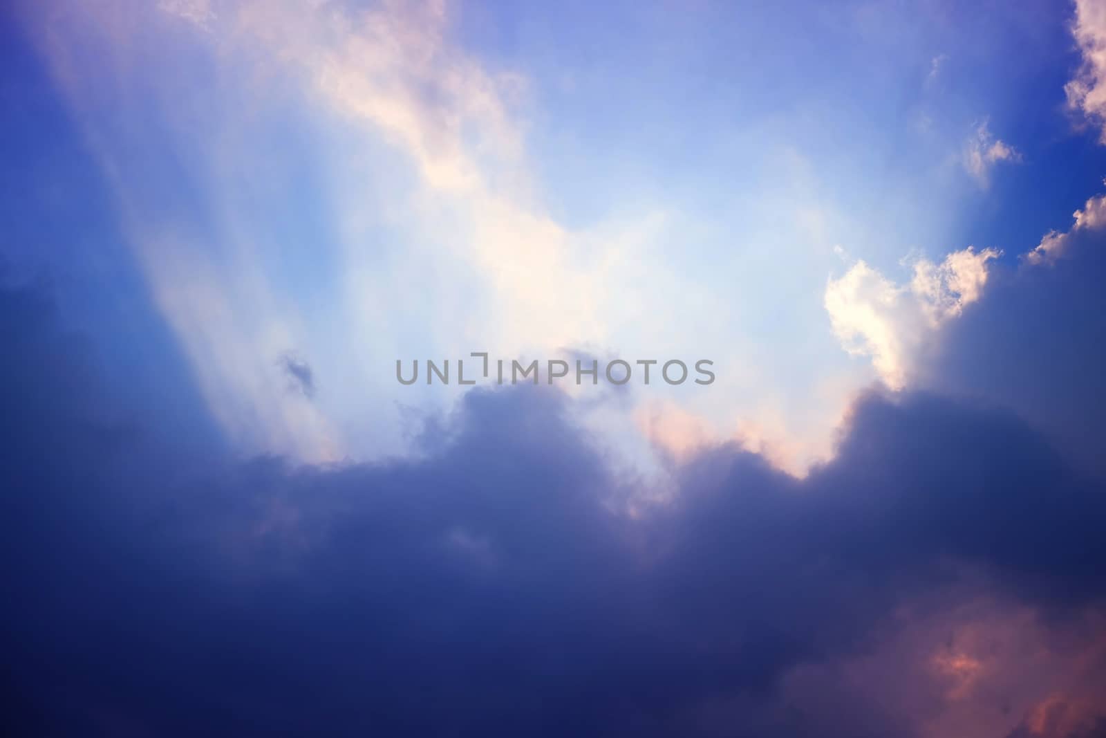 Sunlight Beam Shining Through the Heaven Blue Skies Background. by mesamong