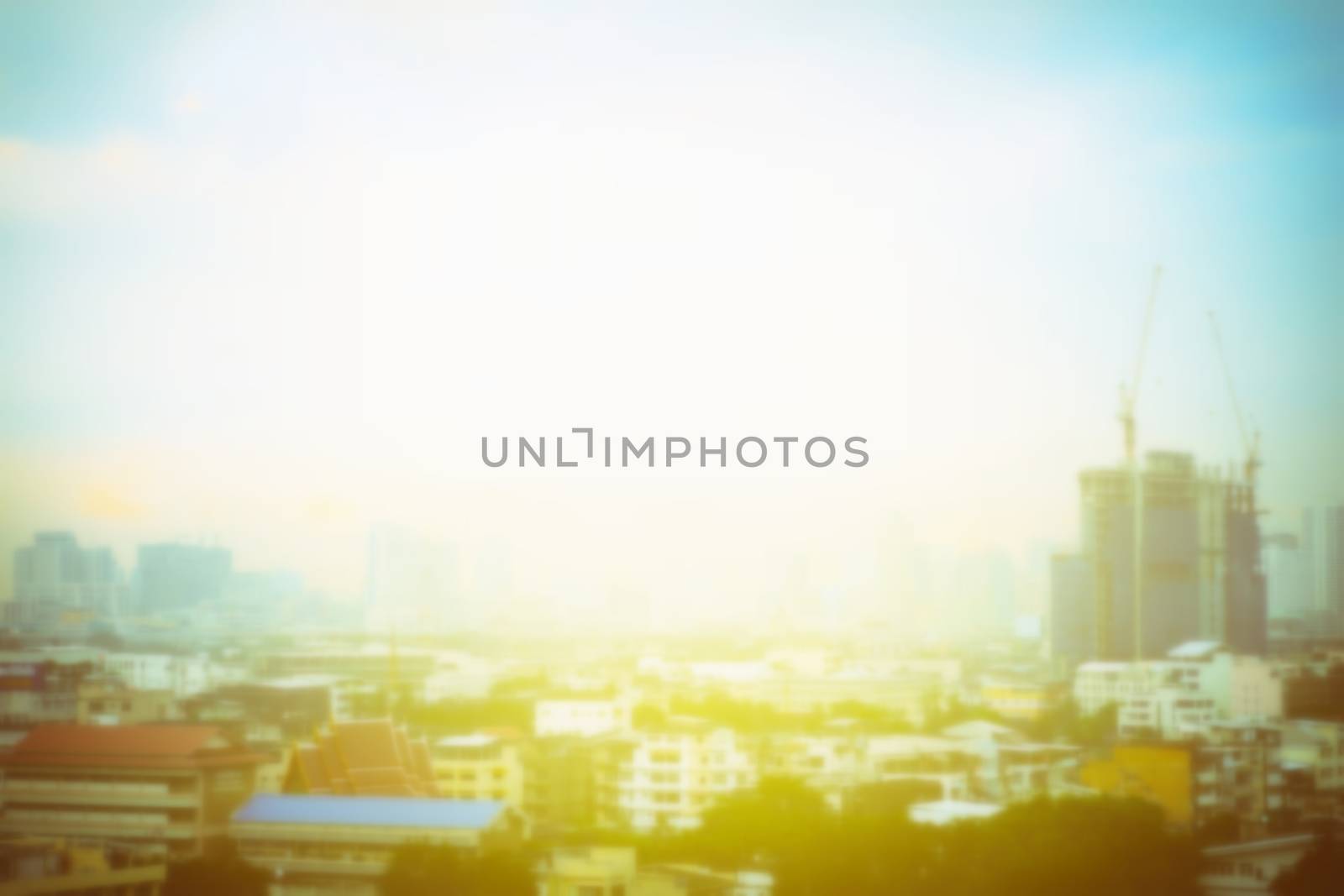 Blurred Building Under Construction and Light Leak Background with Space for Text. by mesamong