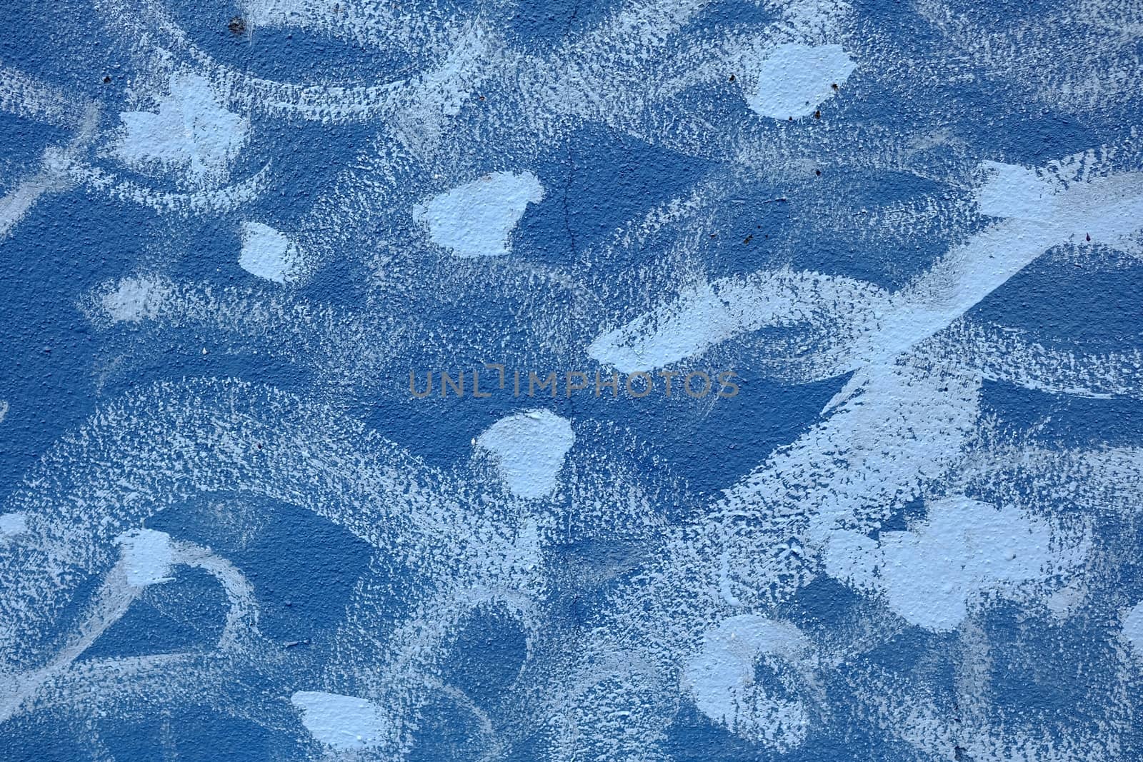 Unfinished White Painting on Grunge Blue Concrete Wall Texture Background.