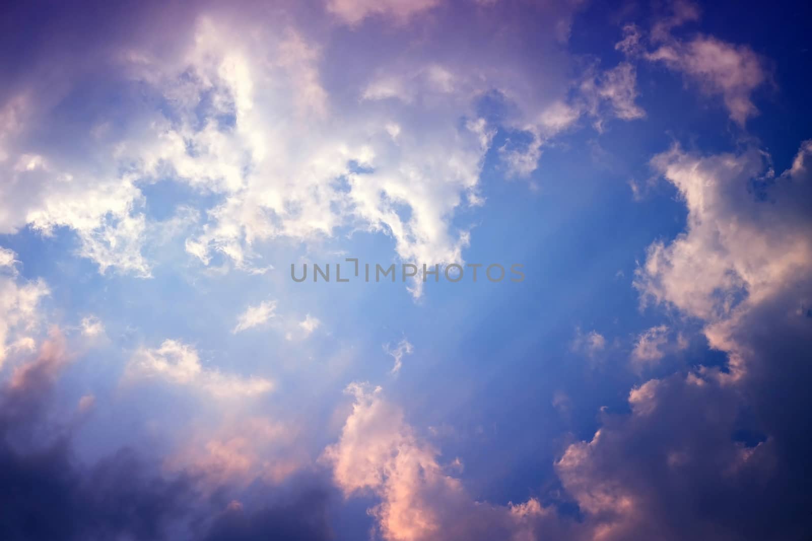 Sunlight Beam Shining Through the Heaven Blue Skies Background. by mesamong