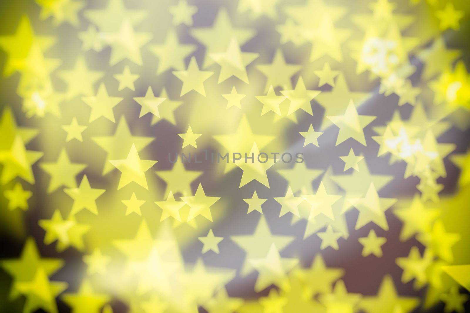 Abstract Yellow Bokeh Star Background. by mesamong