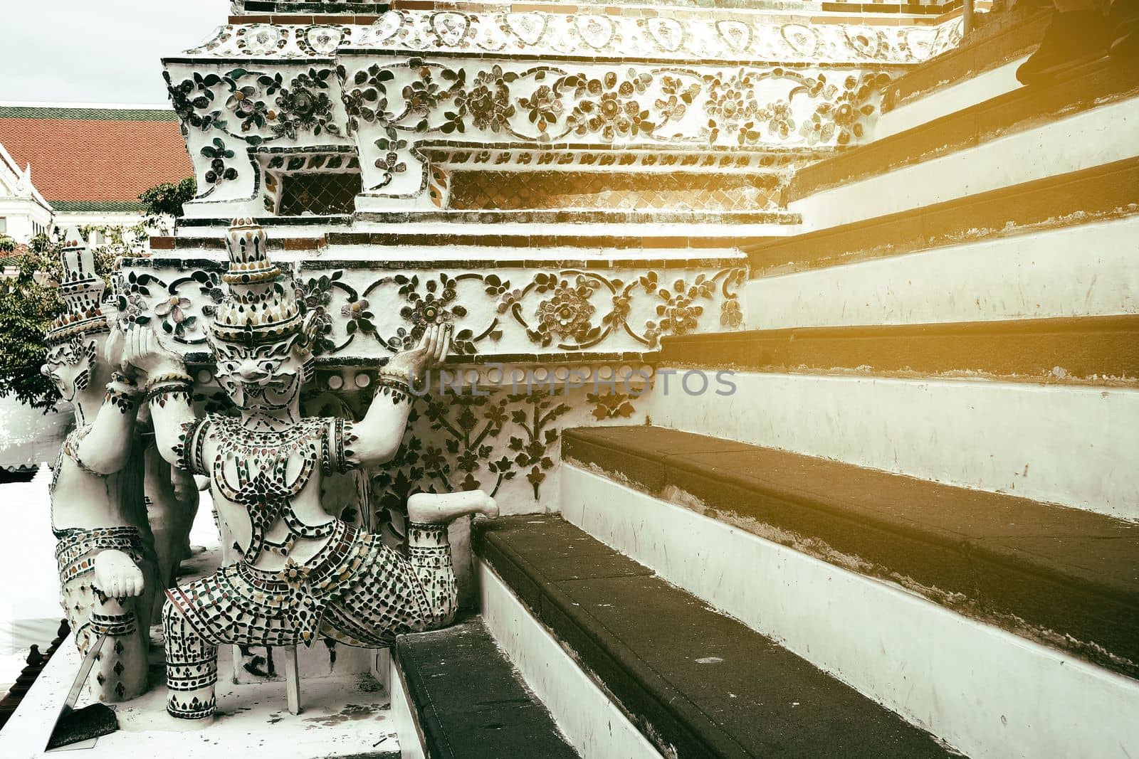 Ancient Giant Statue on Stair to Pagoda at Wat Arun Temple Bangkok, Thailand. by mesamong