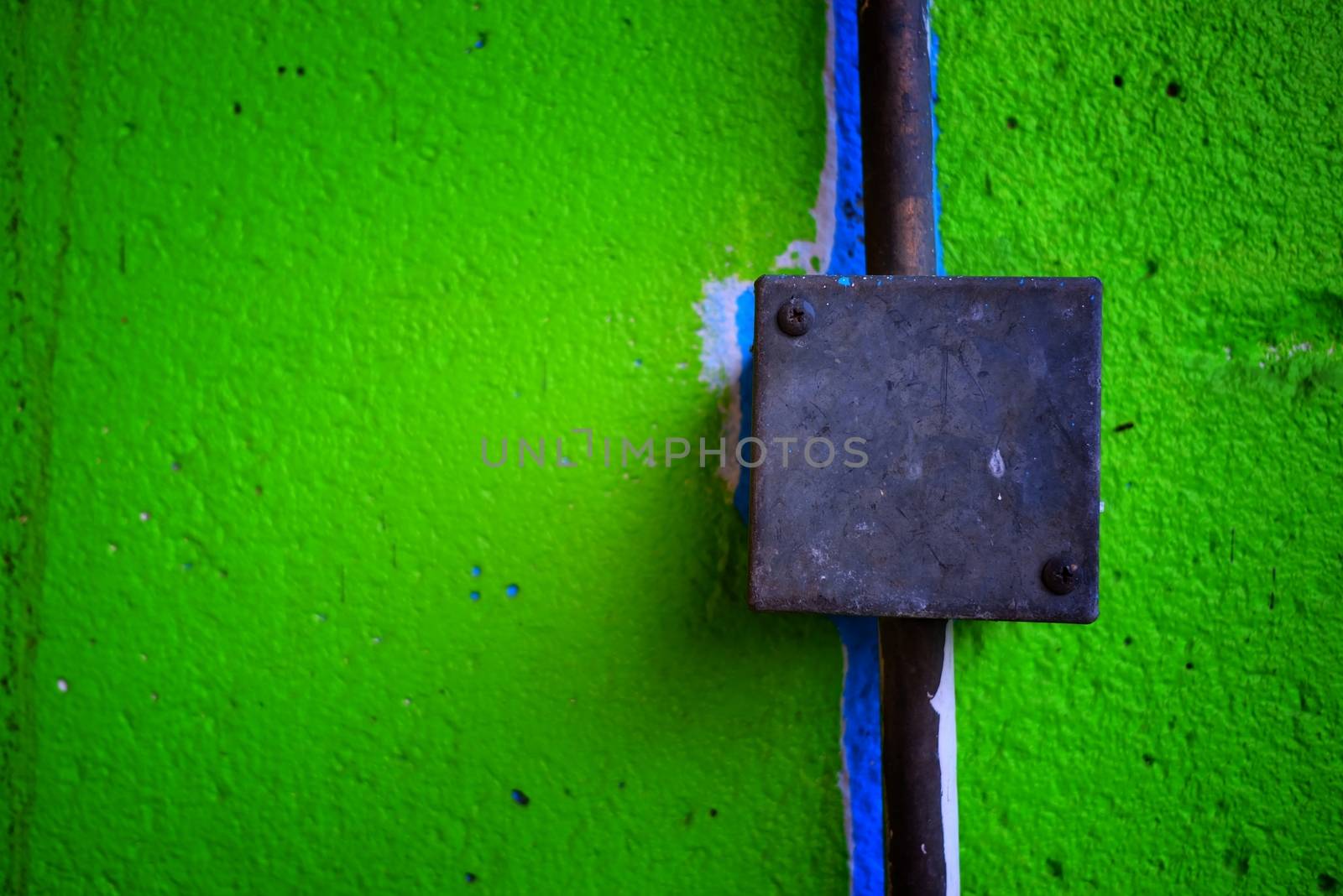 Electrical Box on Green Concrete Wall. by mesamong