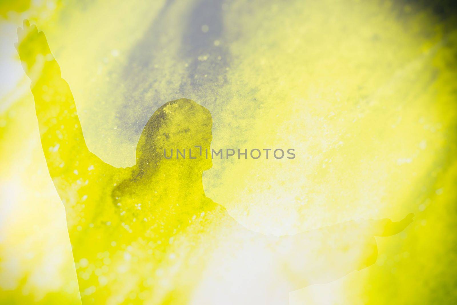 Abstract Double Exposure of Jesus Silhouette with Grunge Light Background.