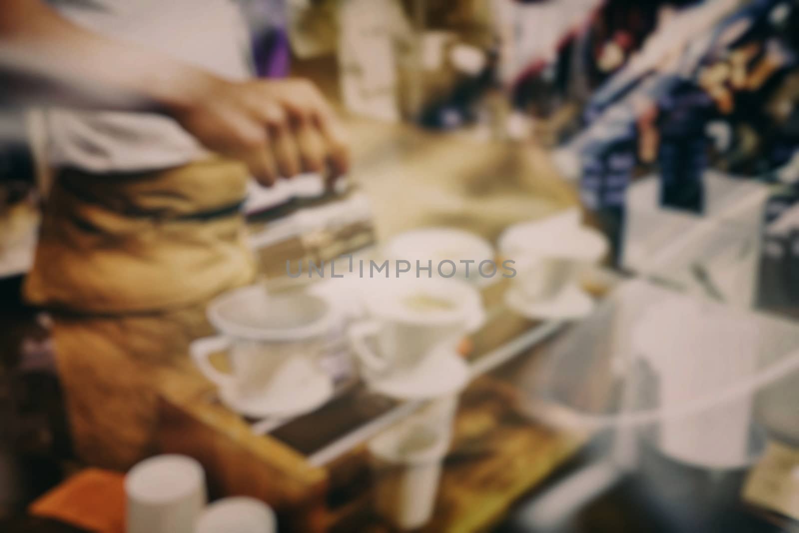 Blurred Barista Making Coffee in Coffee Shop.