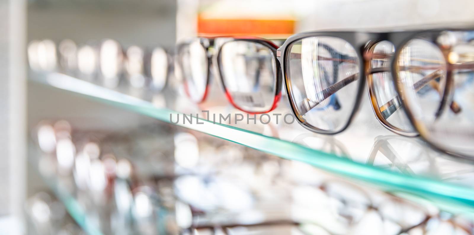 glass display case with dioptric glasses. copy space by Edophoto