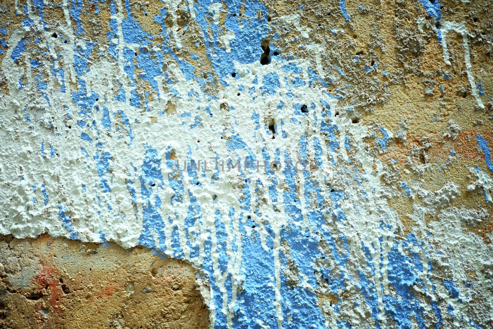 White and Blue Painting on Grunge Concrete Wall Background. by mesamong