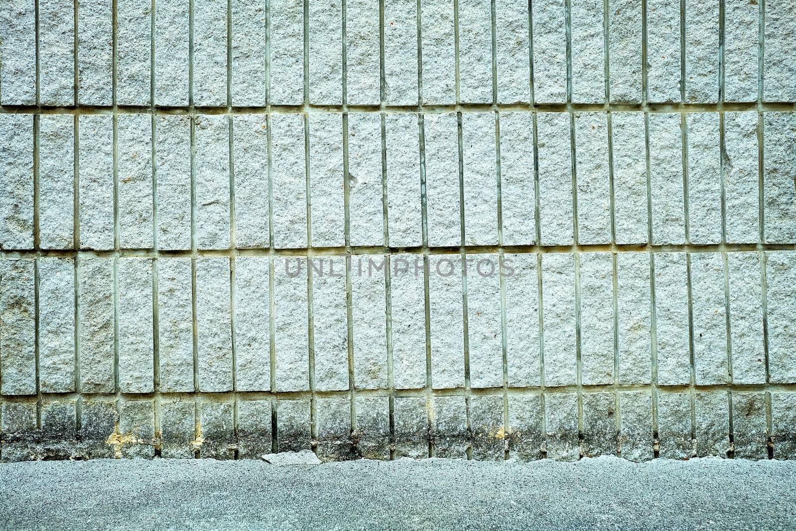 Concrete Wall with Pavement Background.