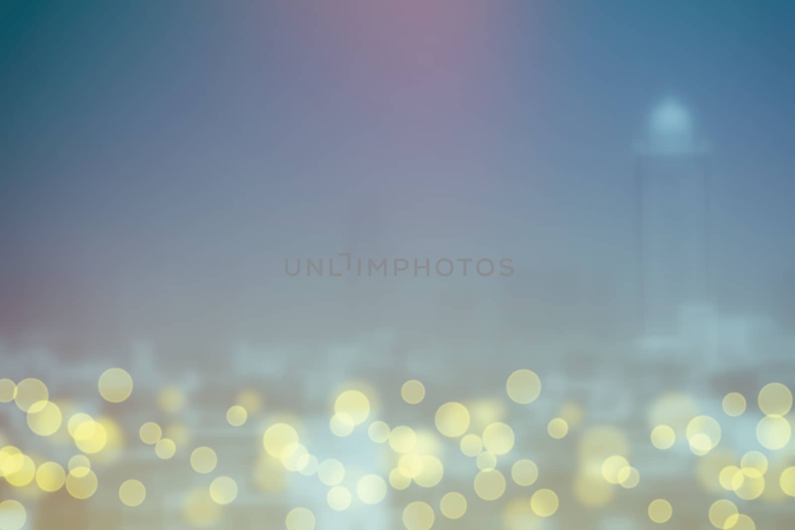 Abstract Yellow Bokeh with Blurred Cityscape Background.