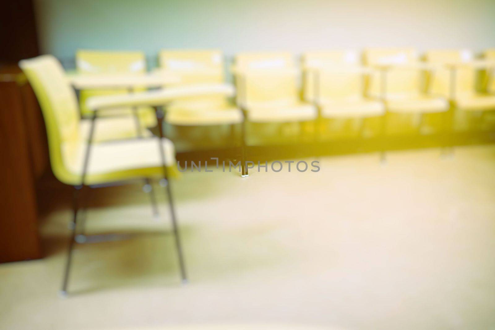 Blurred Lecture Chairs in Classroom with Light Leak Background.