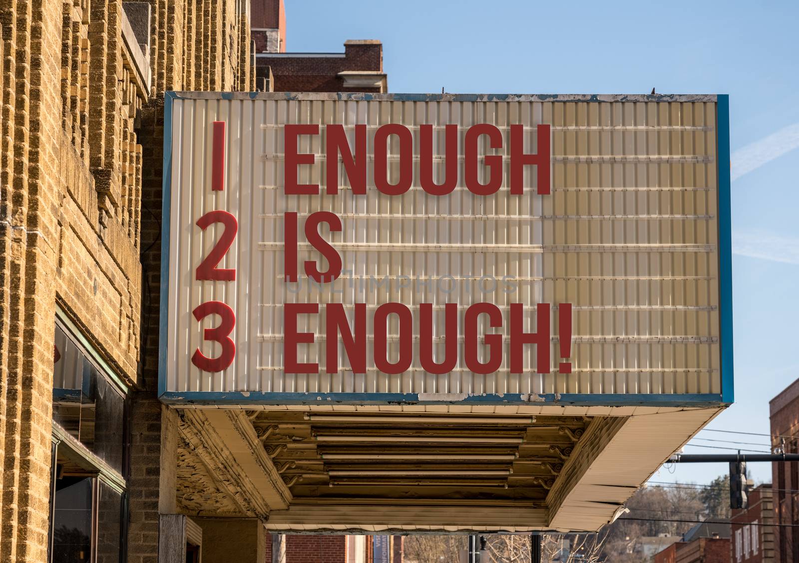 Mockup of movie cinema billboard with Enough is enough on the message board by steheap