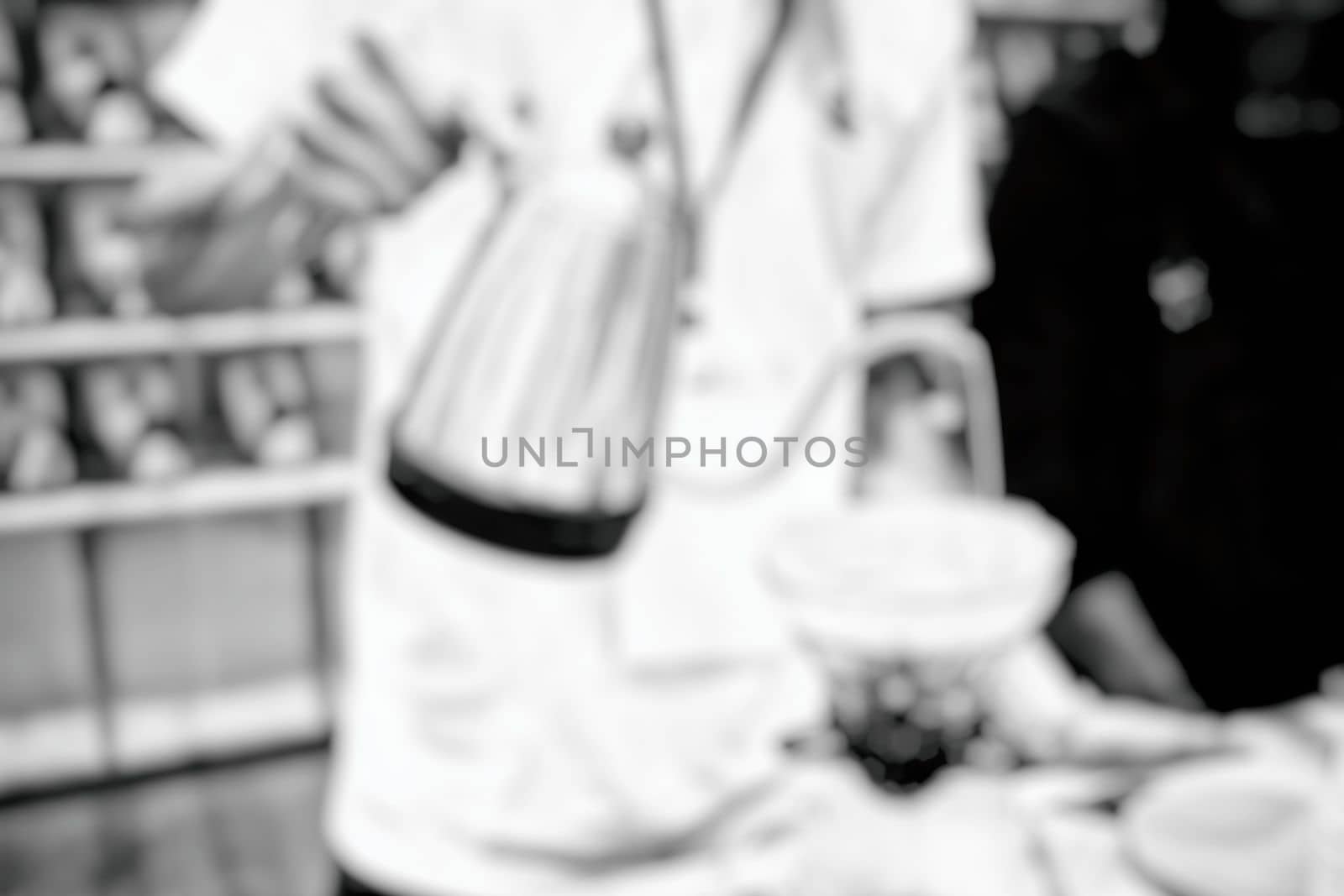 Blurred Barista Making Coffee in Coffee Shop. by mesamong