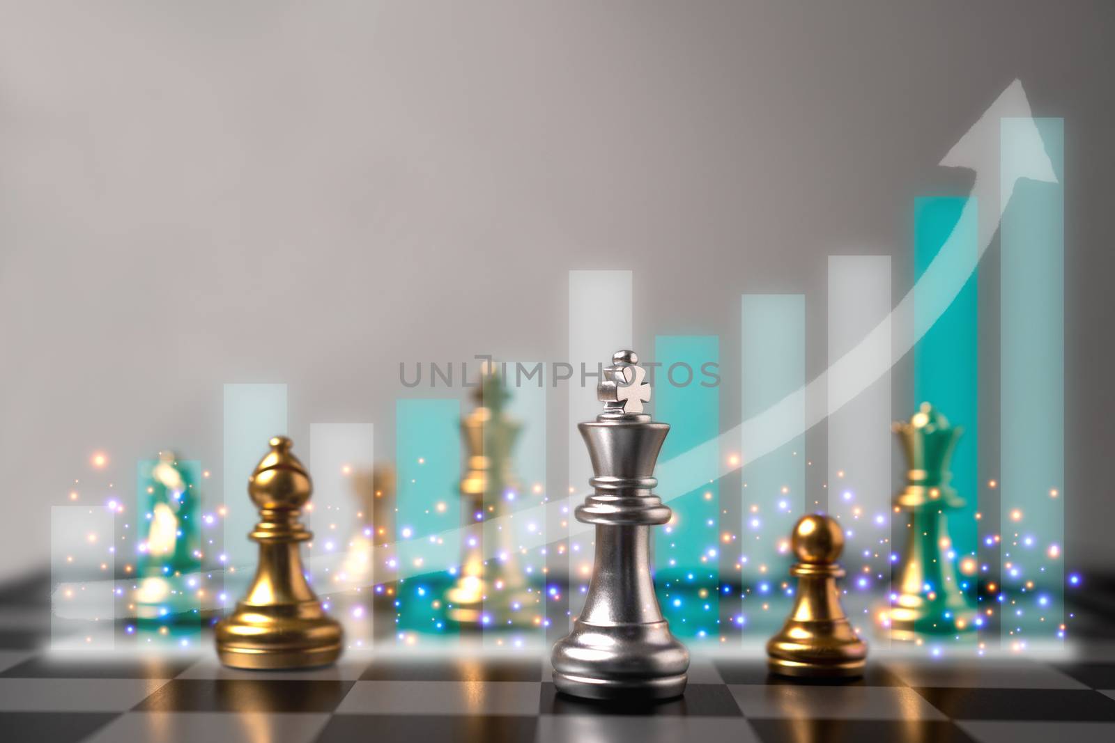 Selective focus of chess and growth business graph behind chess. by PattyPhoto