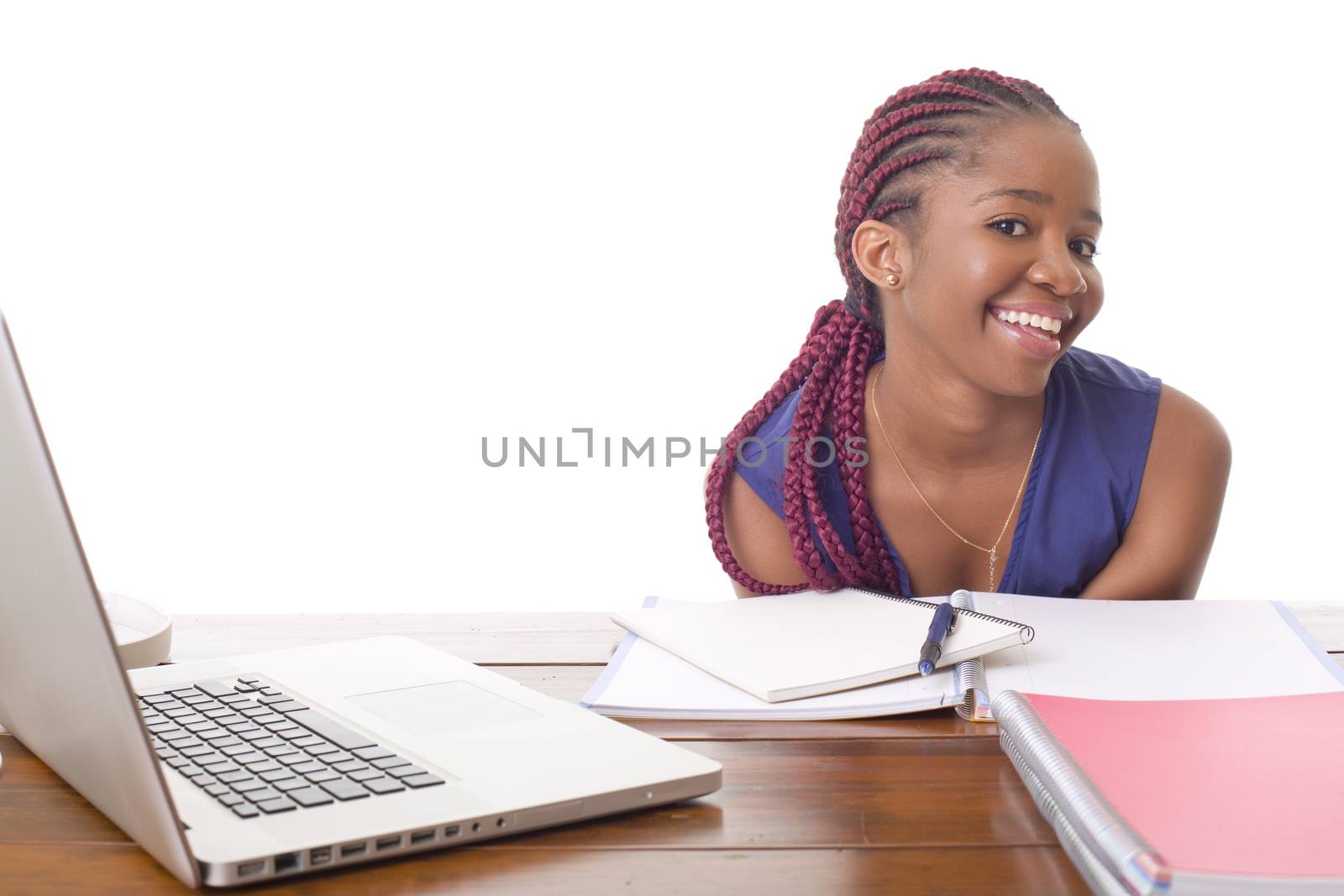 happy beautiful business woman working with a laptop on a desk, isolated on white background