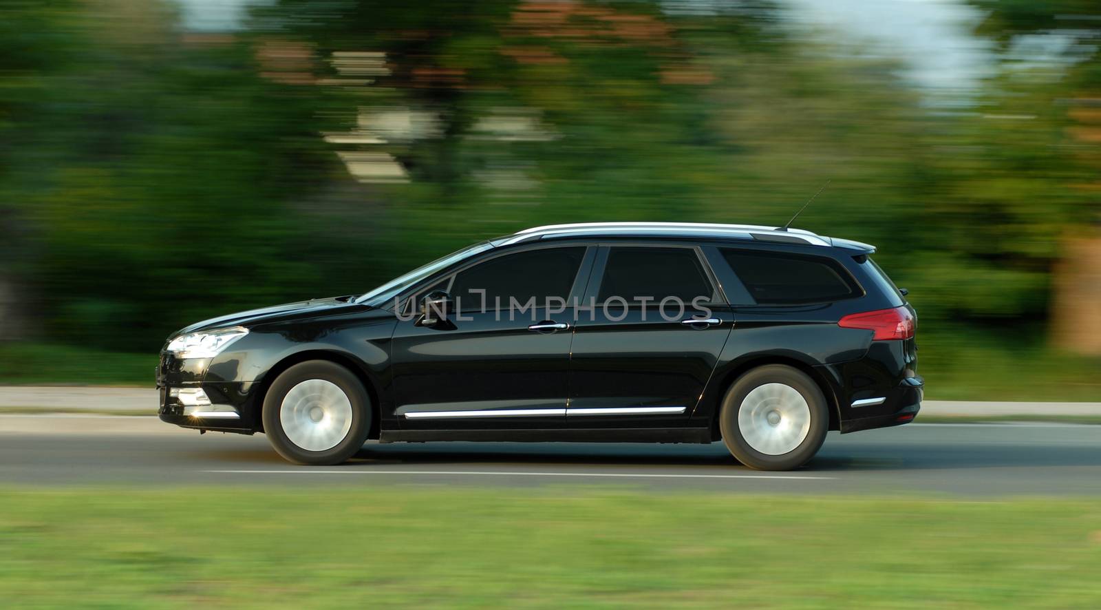 car photographed at high speeds, moving car