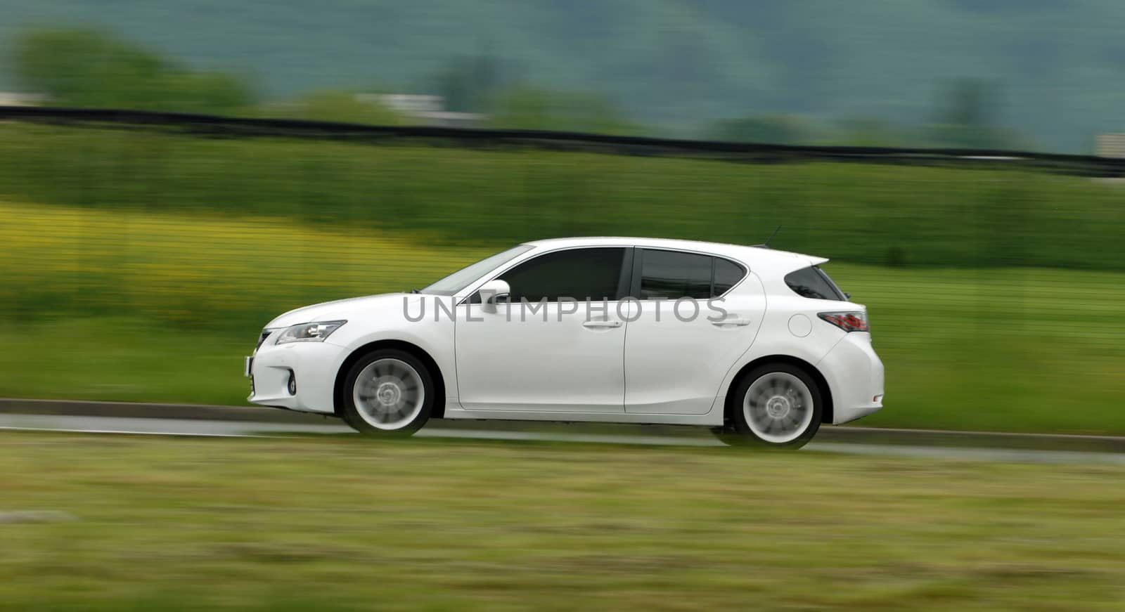 The passenger car drives at a high speed