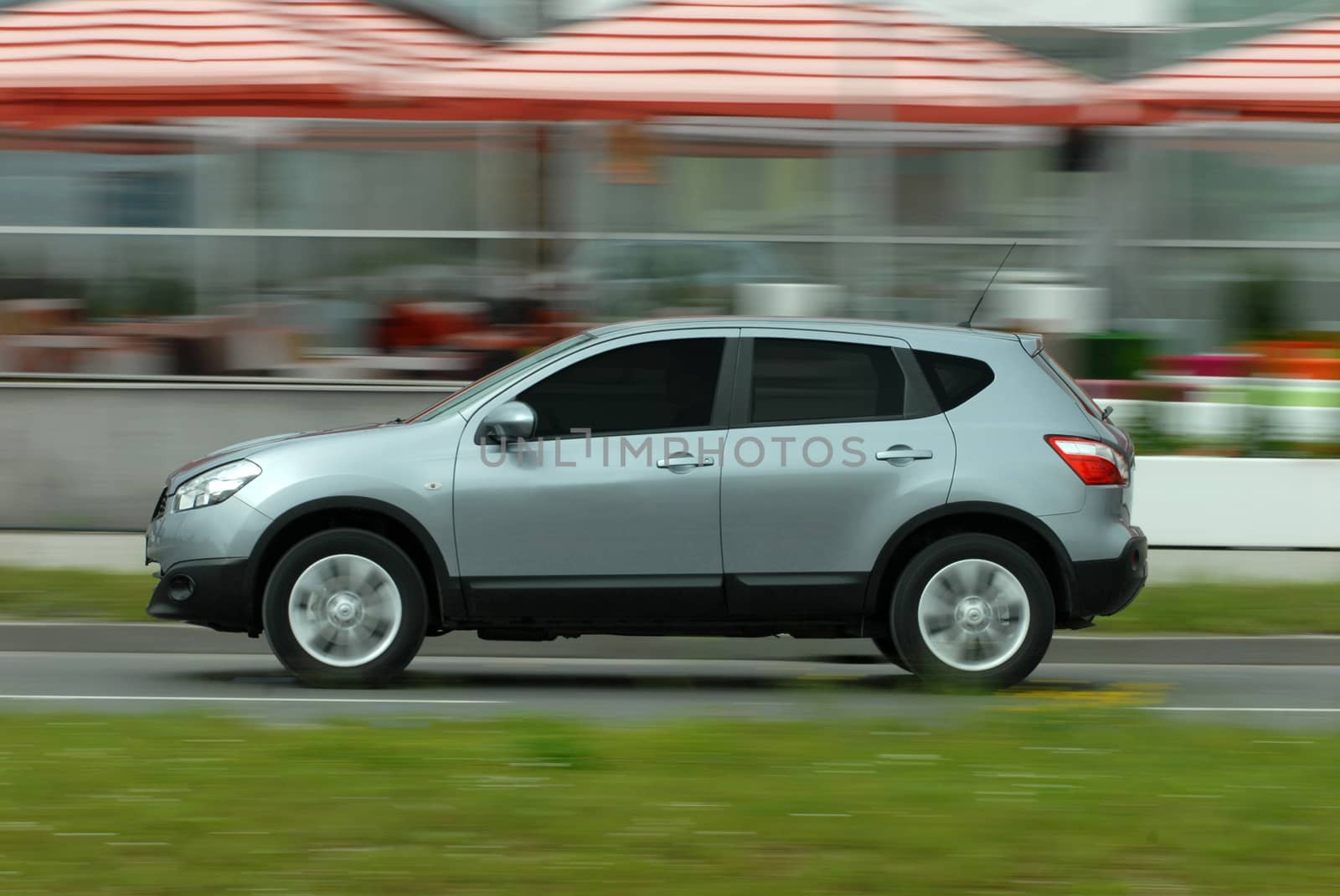 car photographed at high speeds, speedy suv