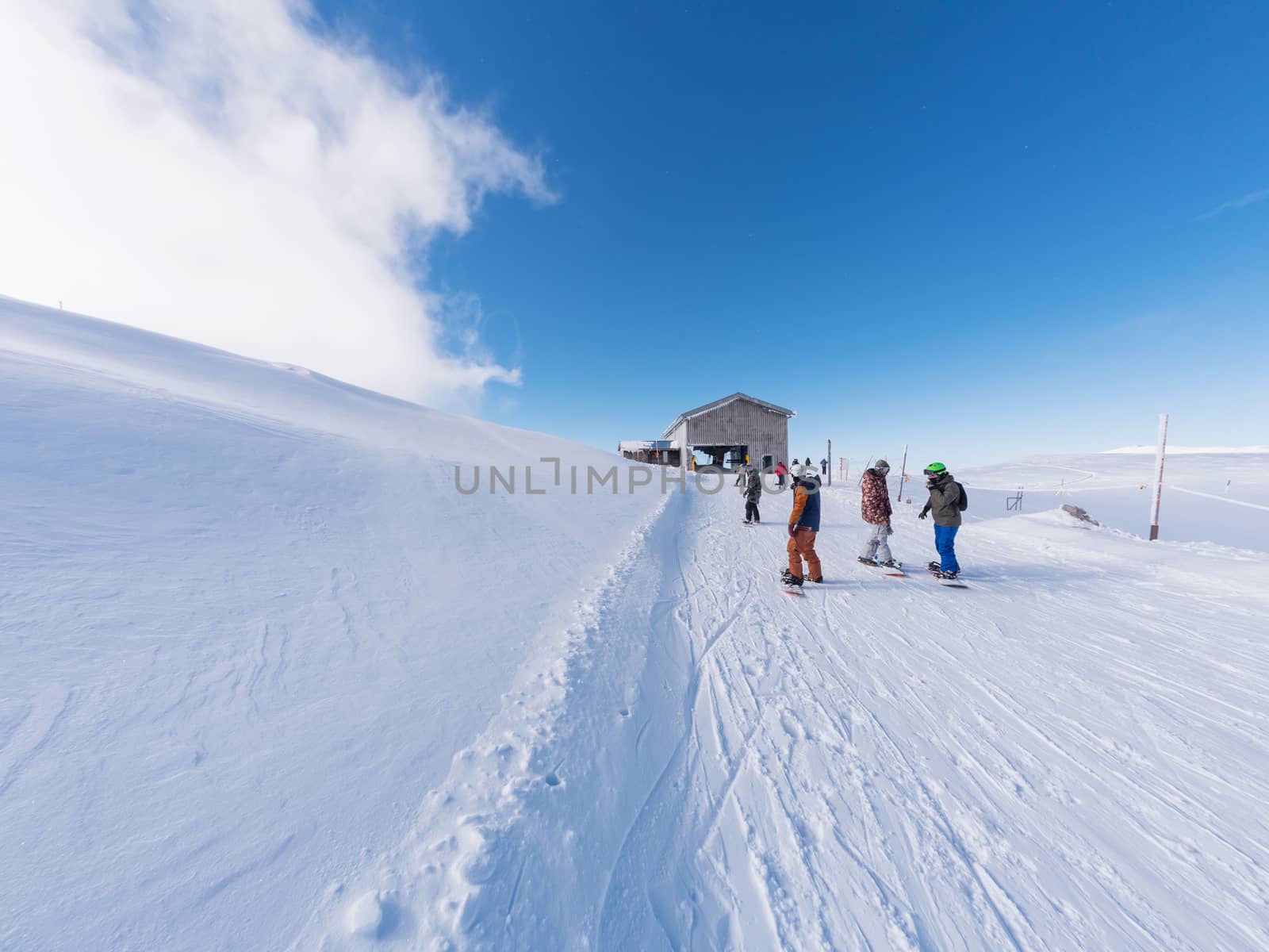 PARNASSOS, GREECE - JANUARY 5, 2019: Parnassos mountain with snow and people on the slopes in a sunny day