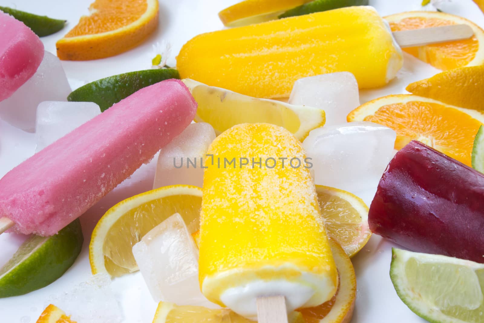 Ice creams with fruit and ice on white background