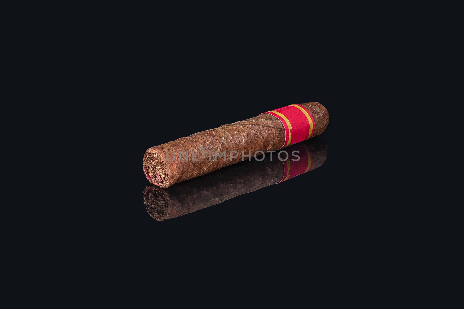 rolled bundle cuban cigar on isolated black background with reflection