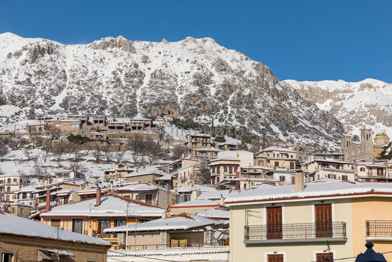 ARAHOVA, GREECE - JANUARY 6, 2019: Arahova village covered with snow in a sunny day 