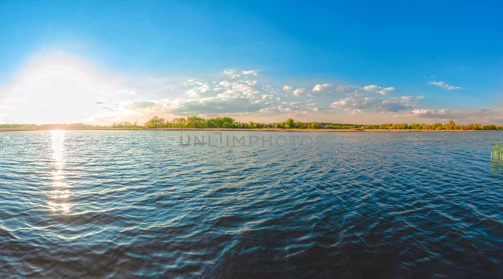 Panoramic view of the Kamenka river in the Zhytomyr region of Ukraine. Beautiful landscape of a large blue pond