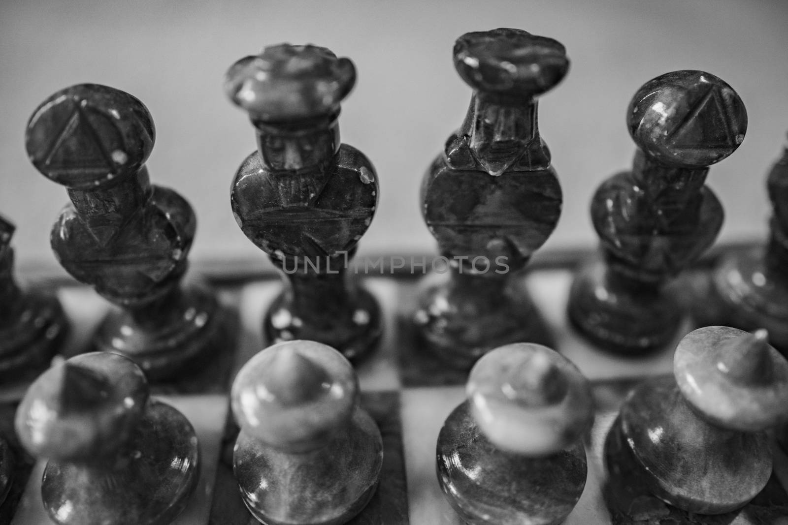 A close up of a chess board and it's pieces