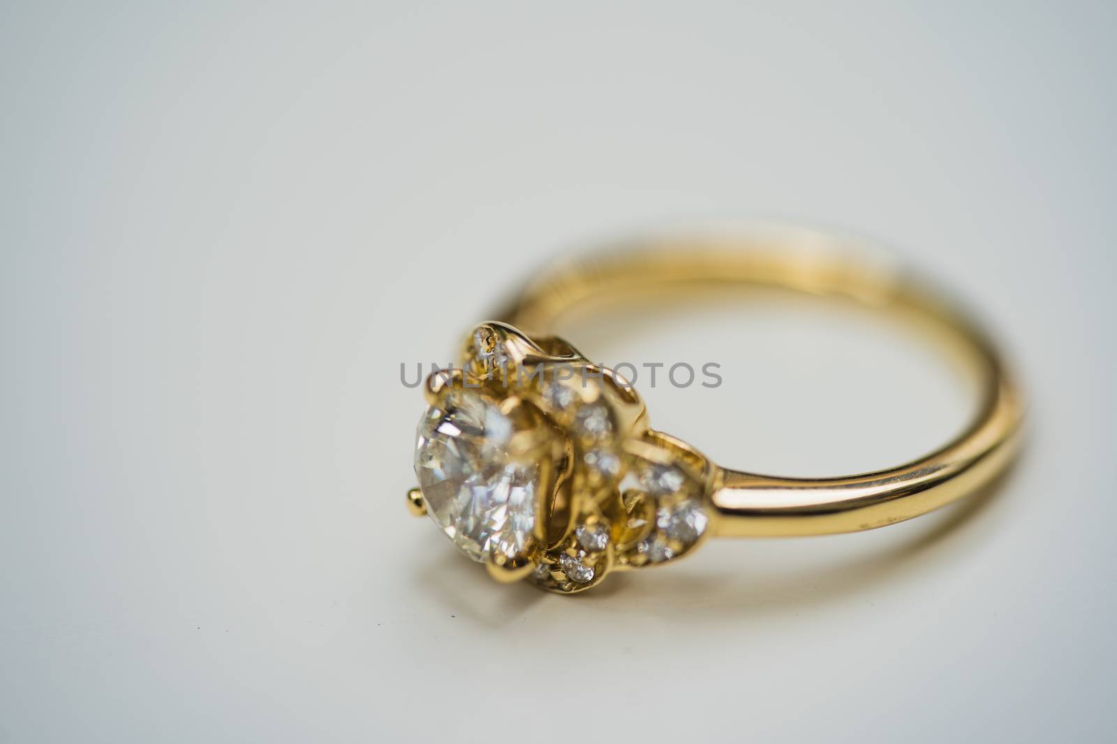 A close up of a beautiful gold diamond engagement ring