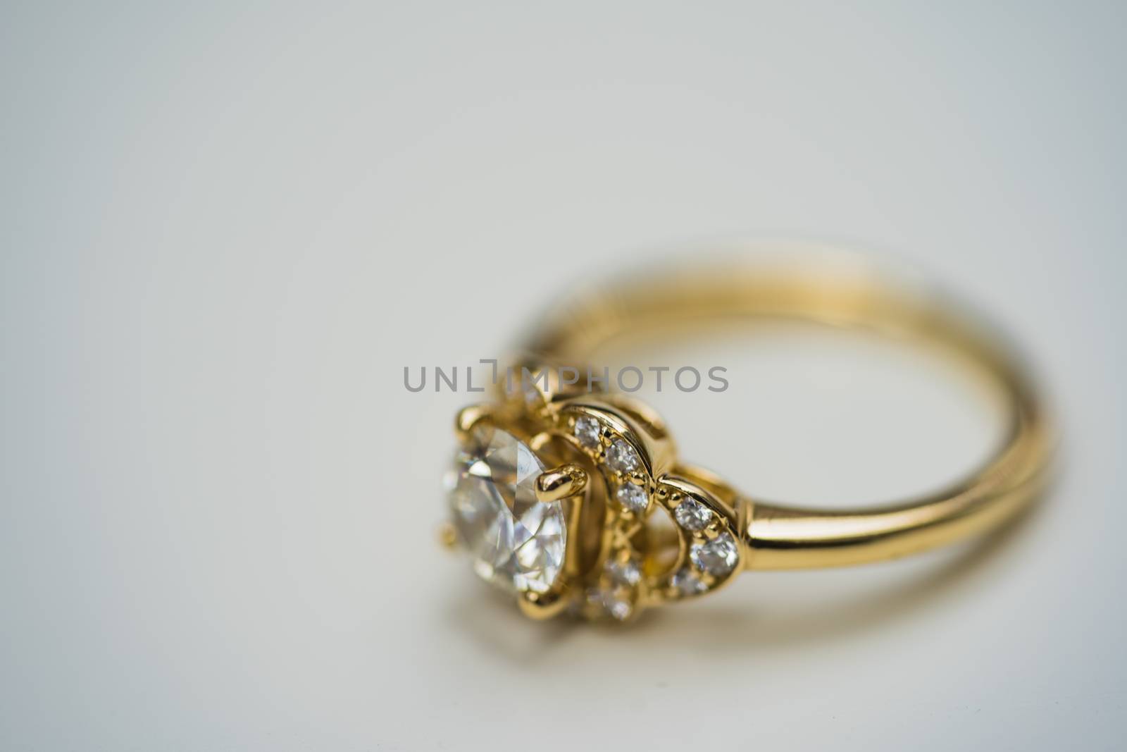 A close up of a beautiful gold diamond engagement ring