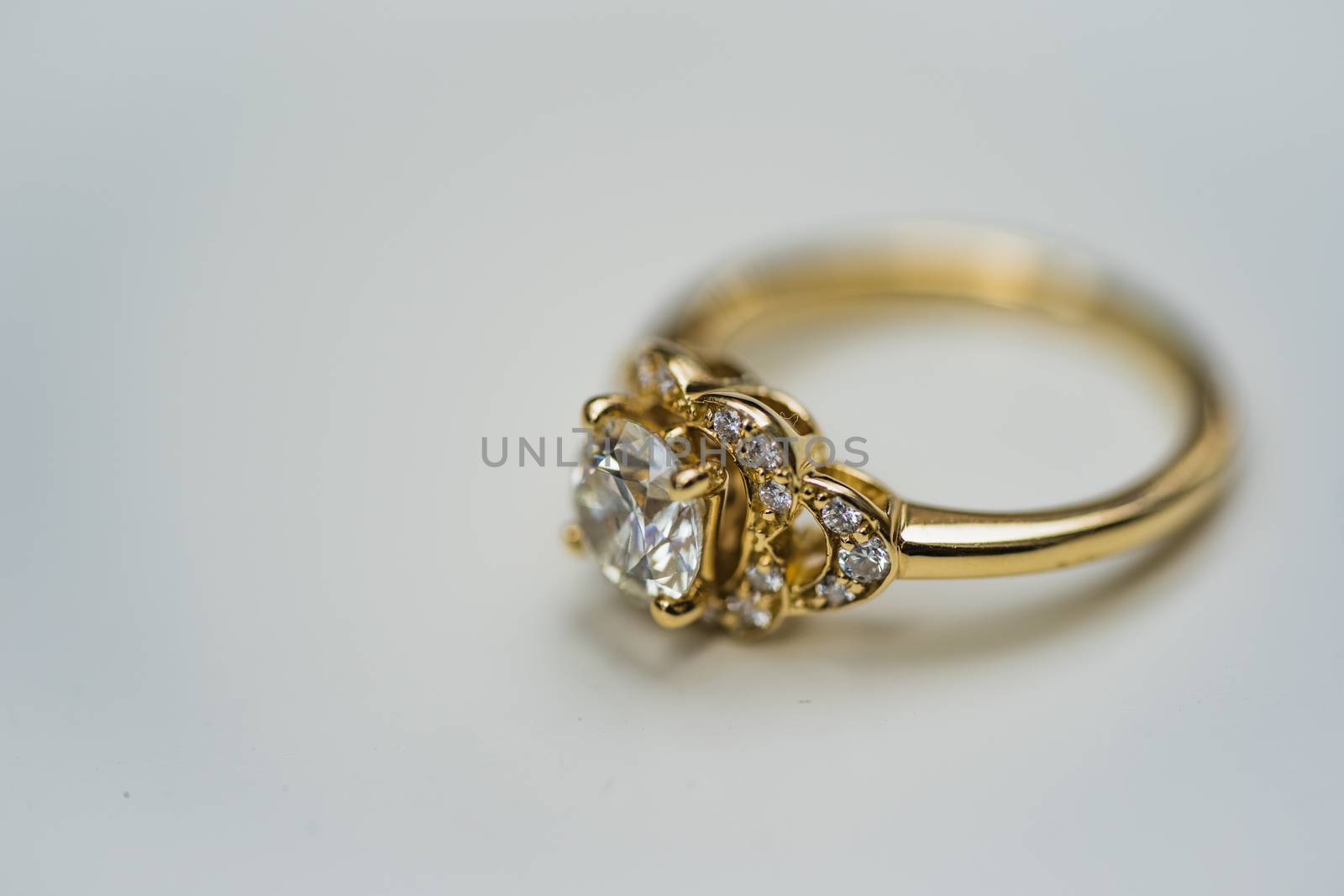A close up of a beautiful gold diamond engagement ring