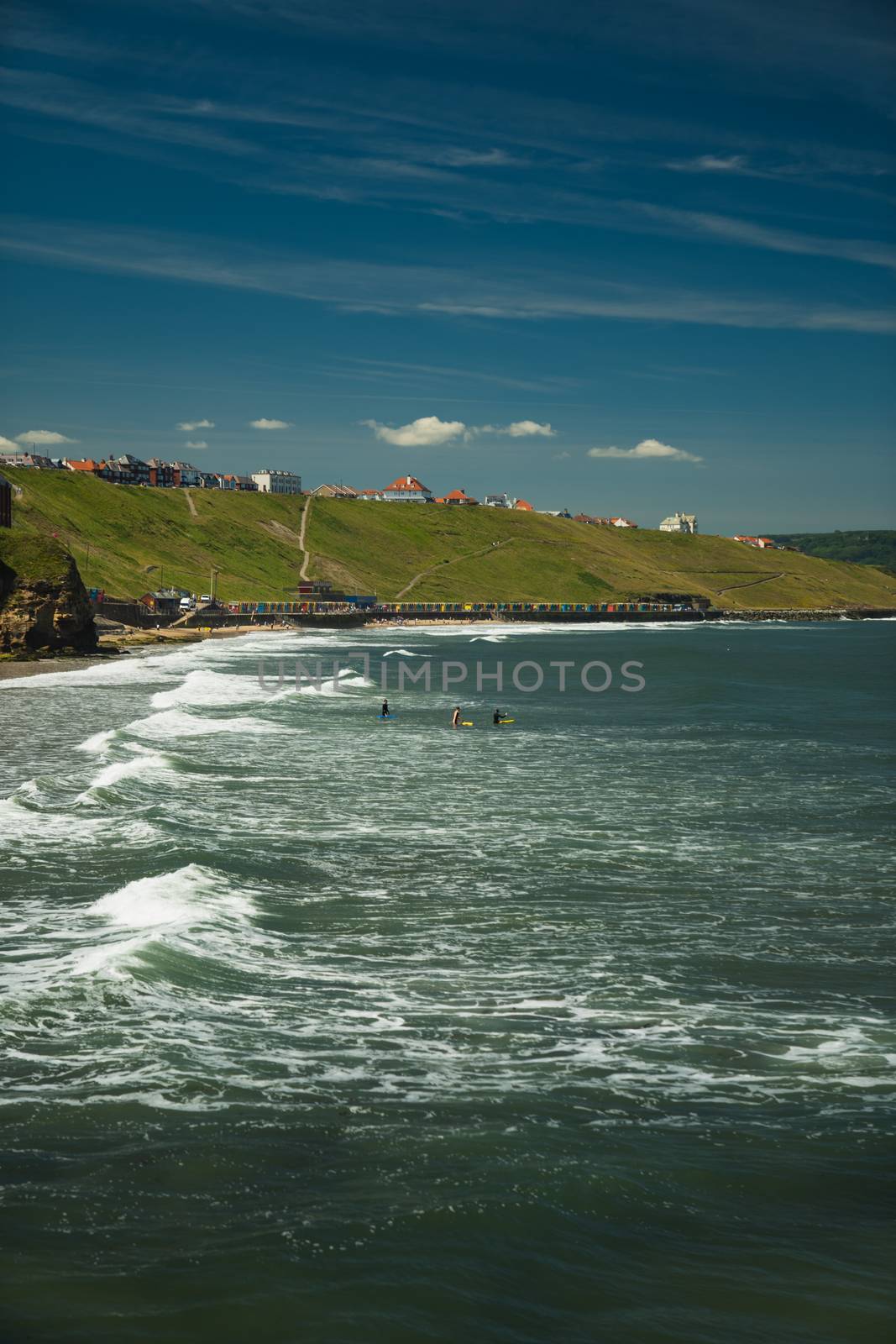 A seaside beach in Yorkshire, England showing the waves on the beach