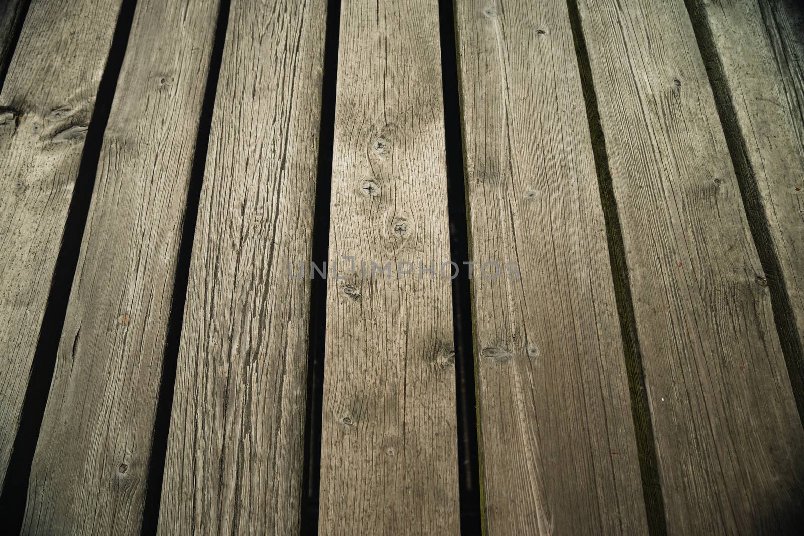 Some wooden planks from a pier in england at th seaside