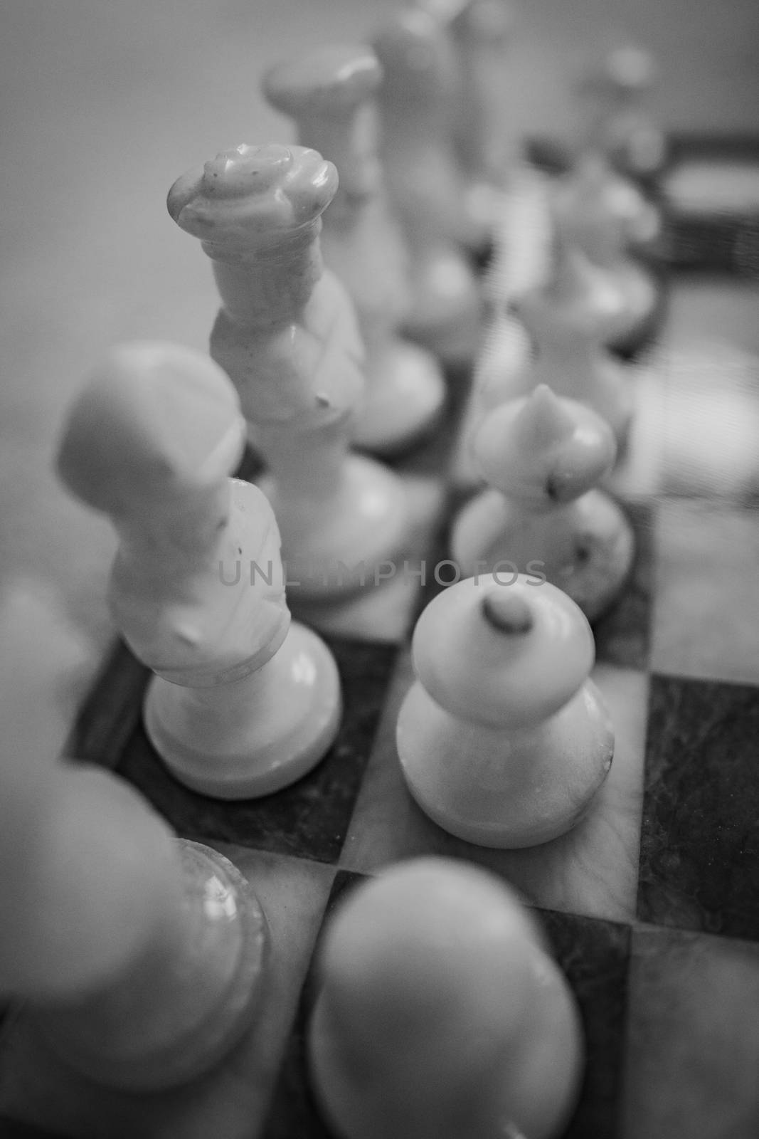 A close up of a chess board and it's pieces