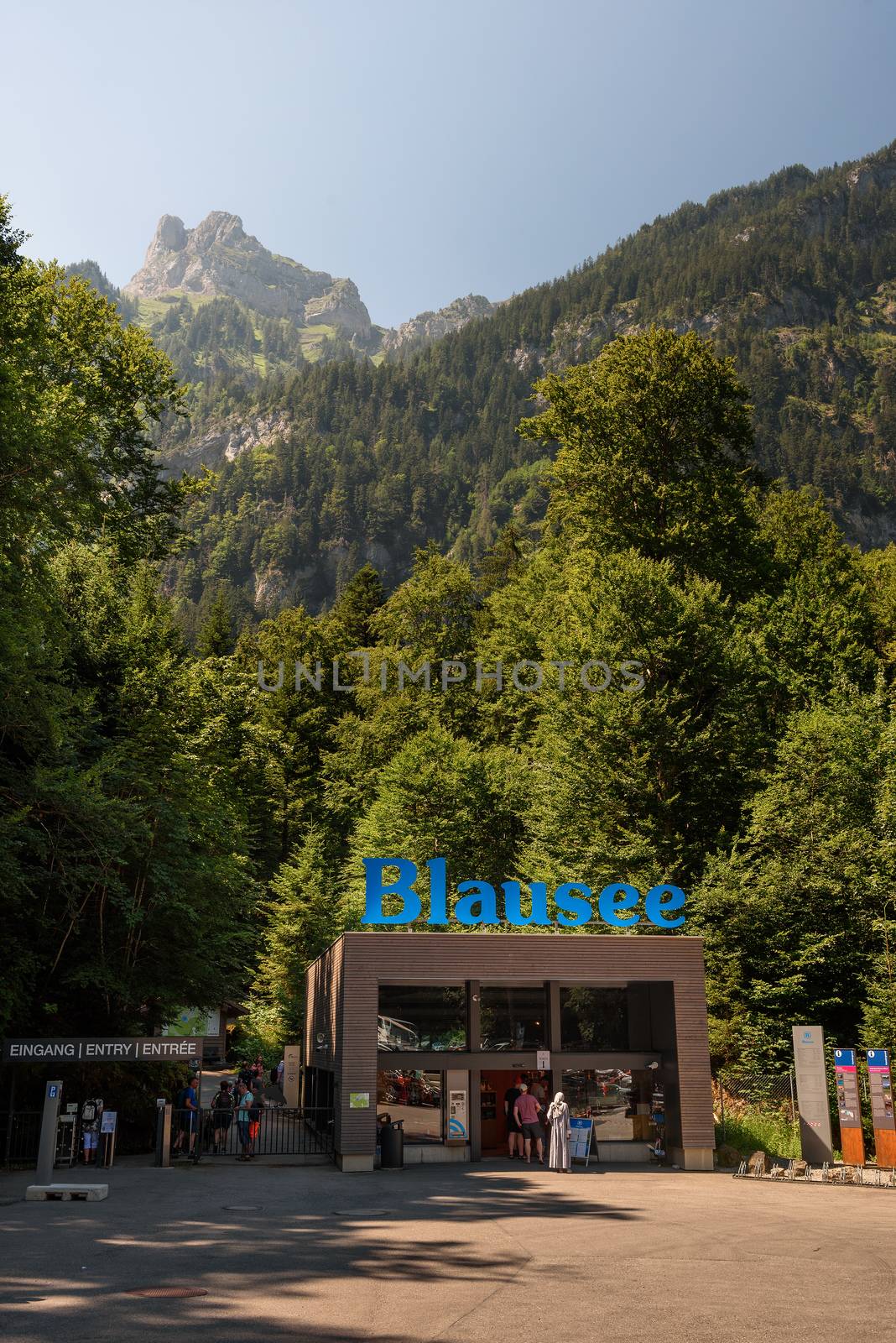 Blausee Lake, Switzerland - July 23, 2019 : Tourists entering the Blausee Lake located in the Kander valley above Kandergrund.