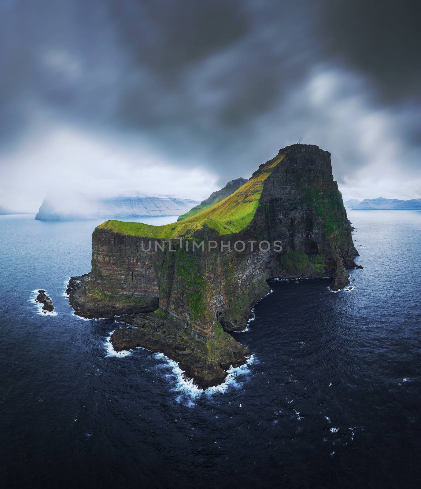 Aerial panorama of massive cliffs of Kalsoy on Faroe Islands by nickfox