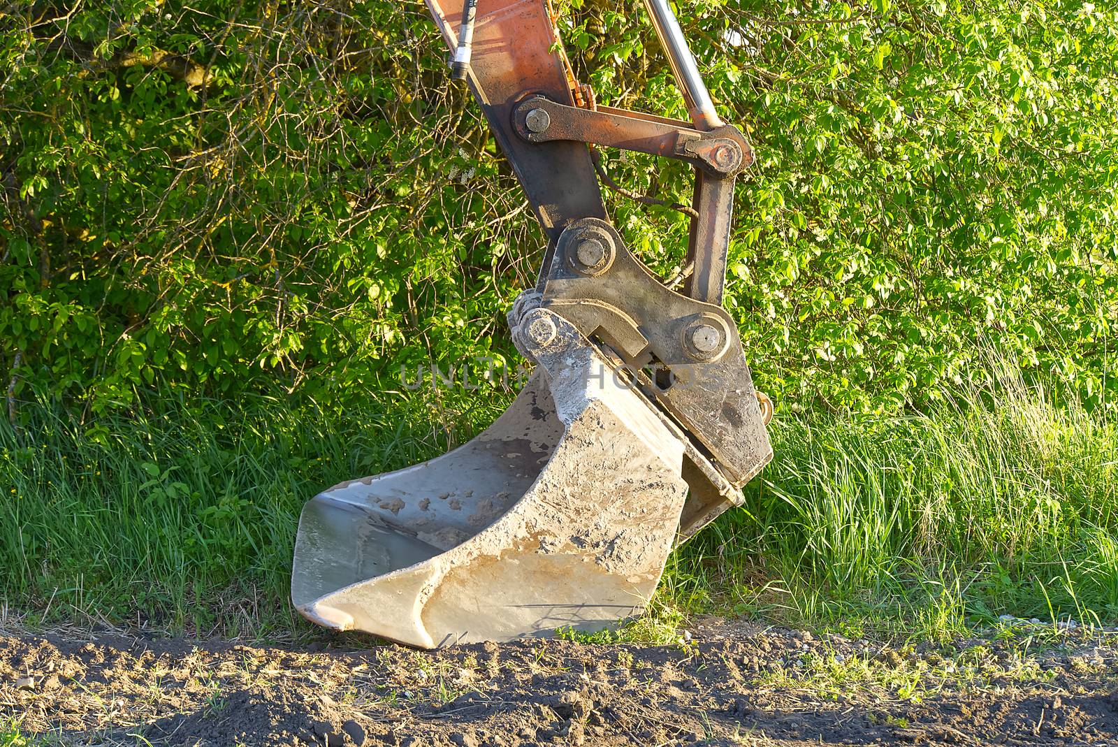 Excavator Bucket. Excavator bucket on ground, Industrial excavator machine. by PhotoTime