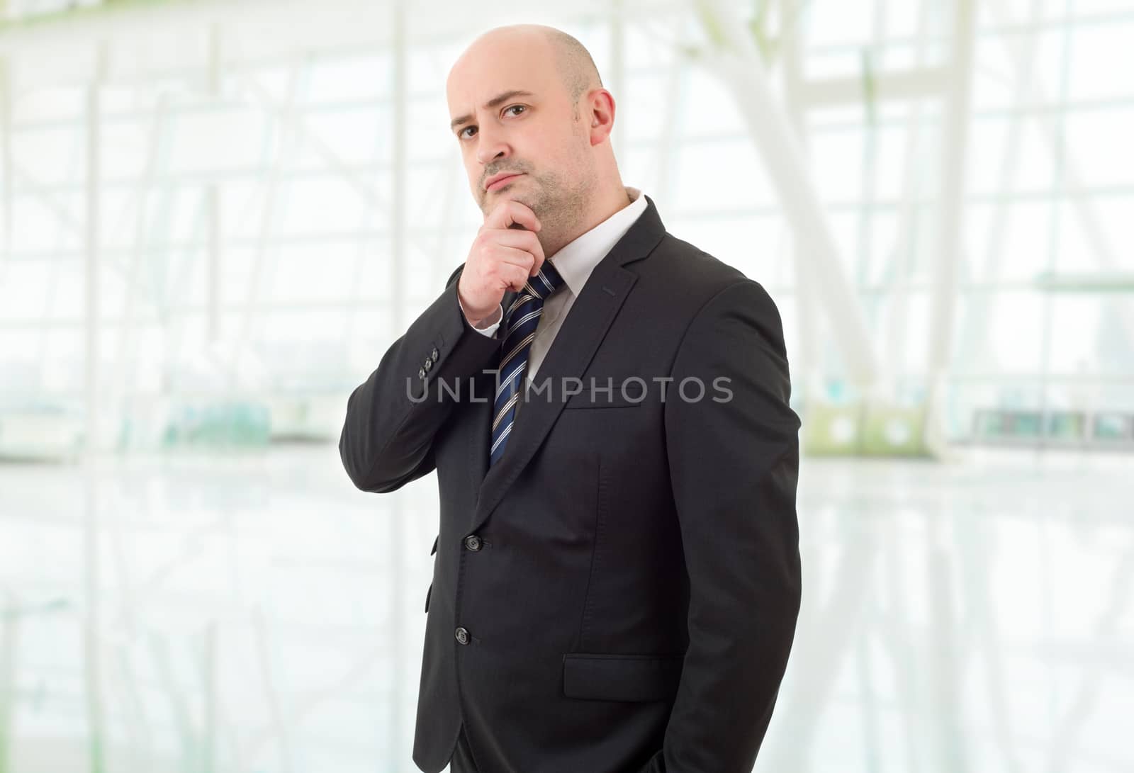 young business man thinking, at the office