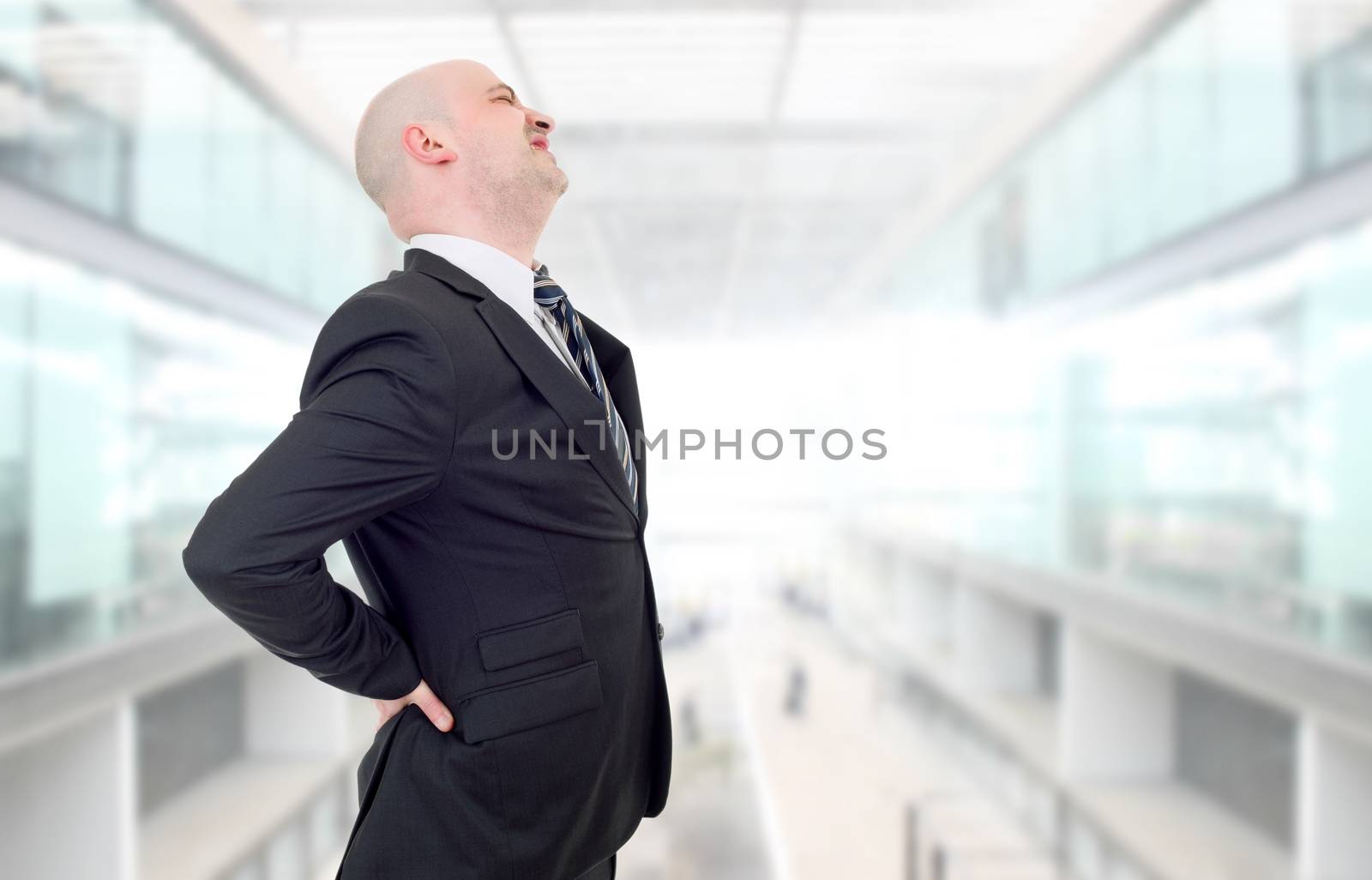 businessman with strong back pain, at the office