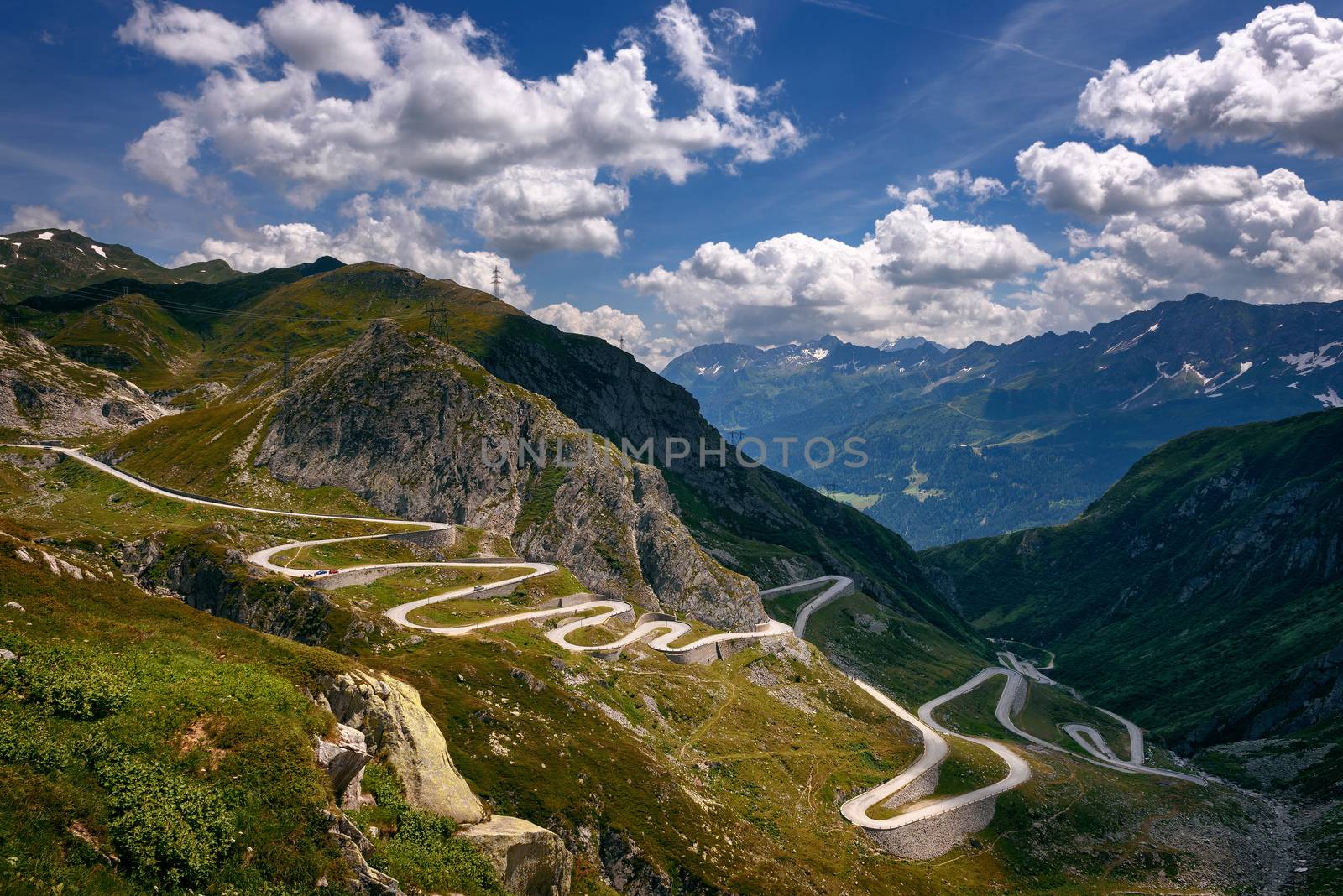 Aerial view of an old road going through the St. Gotthard pass in the Swiss Alps by nickfox