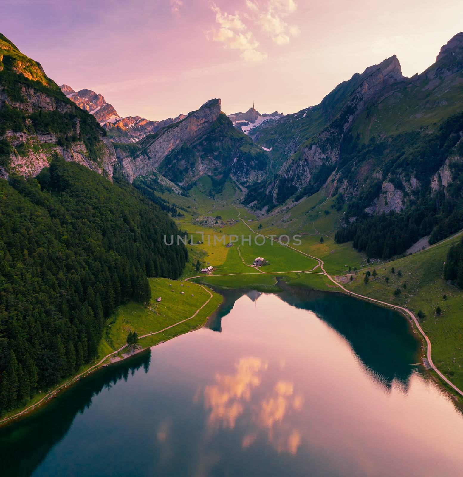 Aerial view of the Seealpsee lake in the Swiss Alps at sunset by nickfox