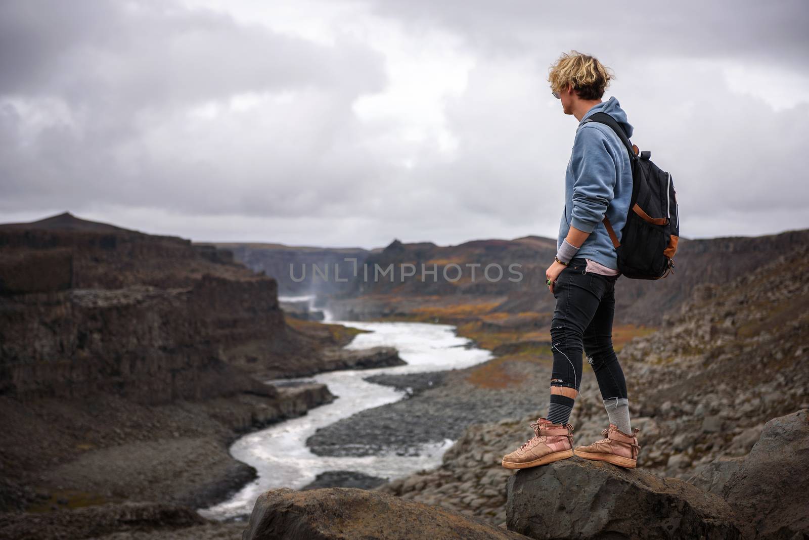 Hiker standing at the edge of a Valley in Vatnajokull National Park in Iceland by nickfox
