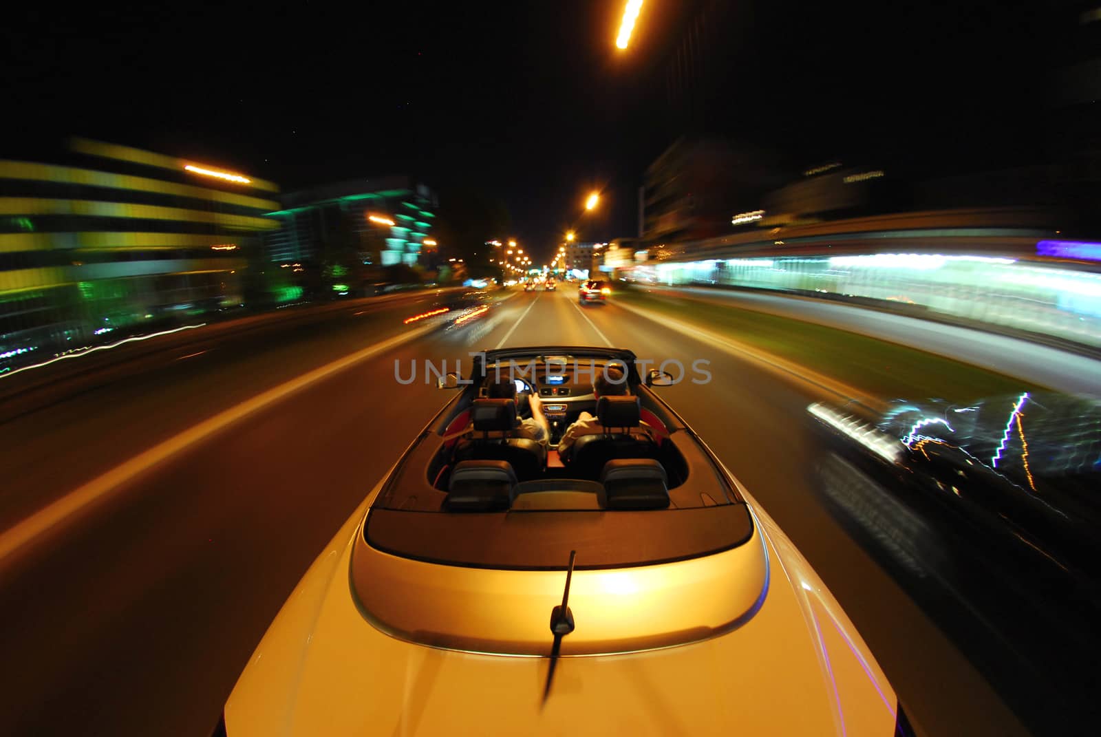 night driving a convertible with the top down