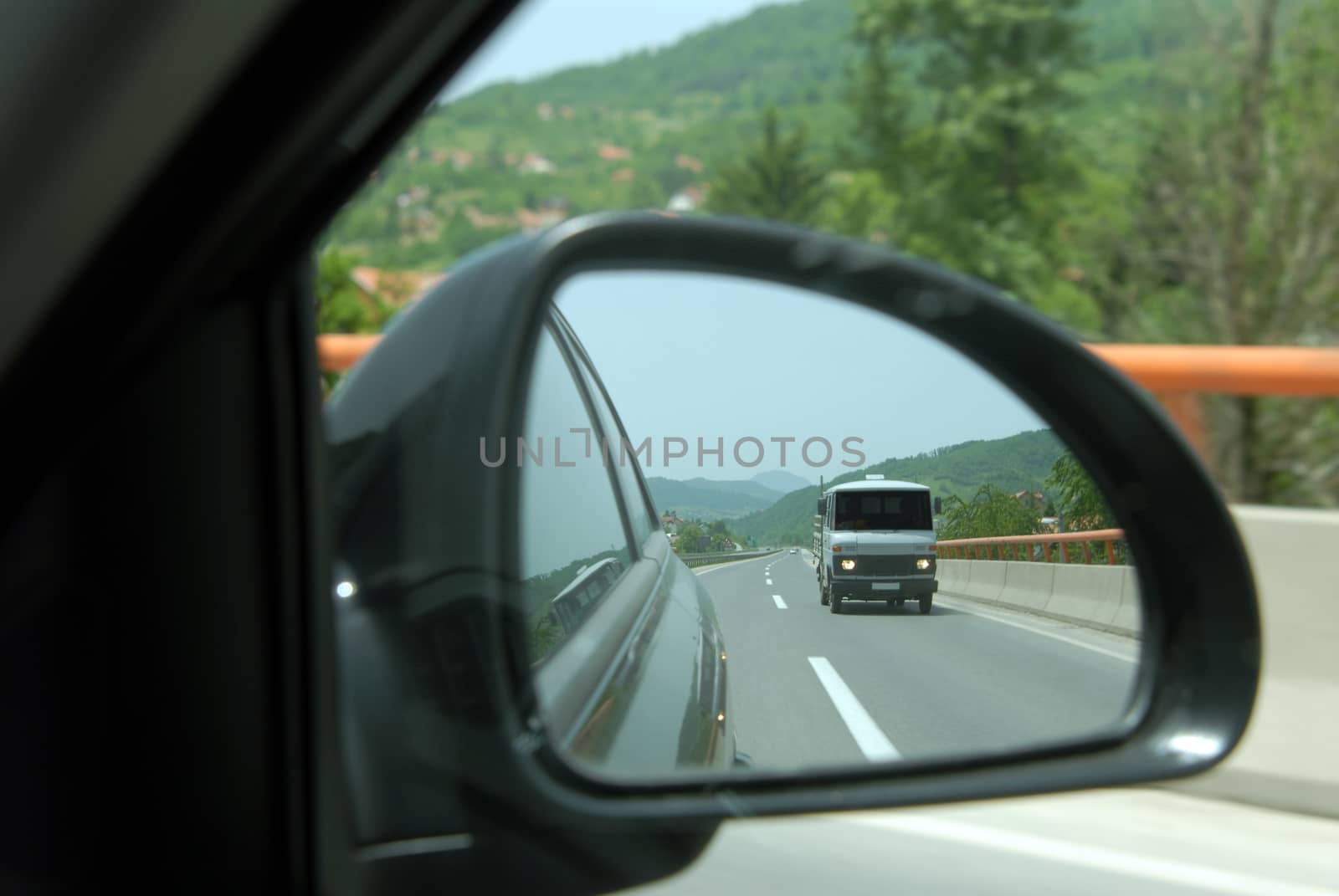 part of the car, rearview mirror, detail from the highway