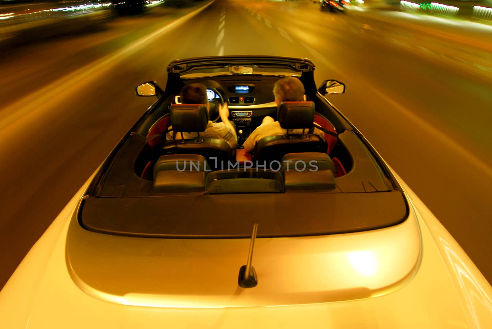 night driving a convertible with the top down